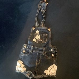 Blue Jean overalls with white floral stitching